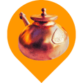 The image showcases a Jala Neti pot crafted from metallic copper and adorned with a beautiful Isha engraving. This Jala Neti pot is an ideal tool for the traditional nasal cleansing practice, helping to alleviate issues like colds, allergies, sinusitis, headaches, kapha-related ailments, asthma, pneumonia, and bronchitis.