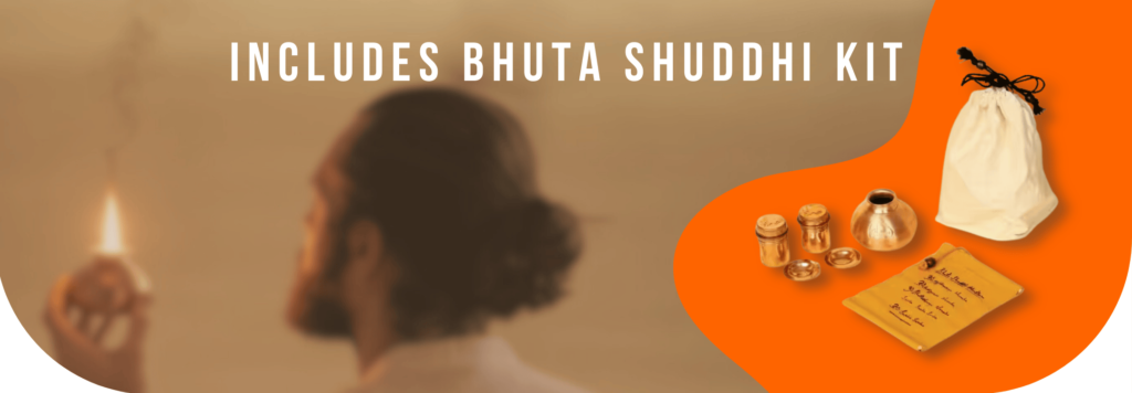 This image depicts a person holding a lit earthen lamp, signifying a traditional, meditative practice. The background is softly blurred, focusing attention on the lamp. To the right, there is a collection of Bhuta Shuddhi items on an orange backdrop. This includes a small metallic pot, containers, and a fabric pouch, representing the Bhuta Shuddhi Kit. The text at the top reads, "Includes Bhuta Shuddhi Kit," highlighting the availability of this specialized set for the practice of elemental purification as part of a traditional yogic ritual.